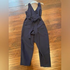 Navy blue ASOS jumpsuit with belt and pockets .